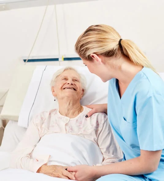 caregiver-with-elderly-woman-hospital