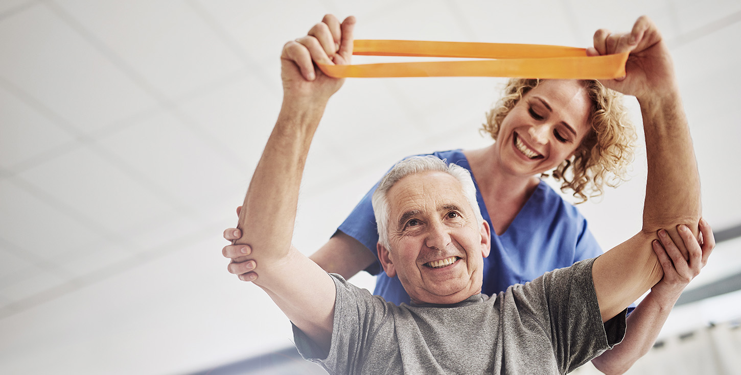 female physician working with senior patient in nursing home